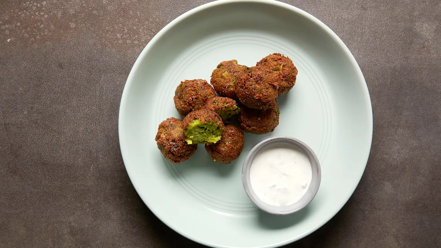 Plate of falafel with dipping sauce Baytown TX