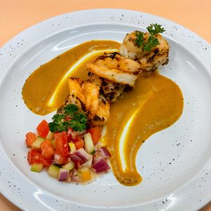 Gourmet seafood dish with sauce in Baytown TX