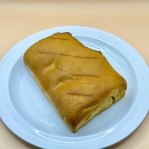 Baked bread roll on white plate Baytown TX