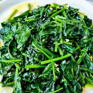 Fresh sautéed spinach on white plate Baytown TX